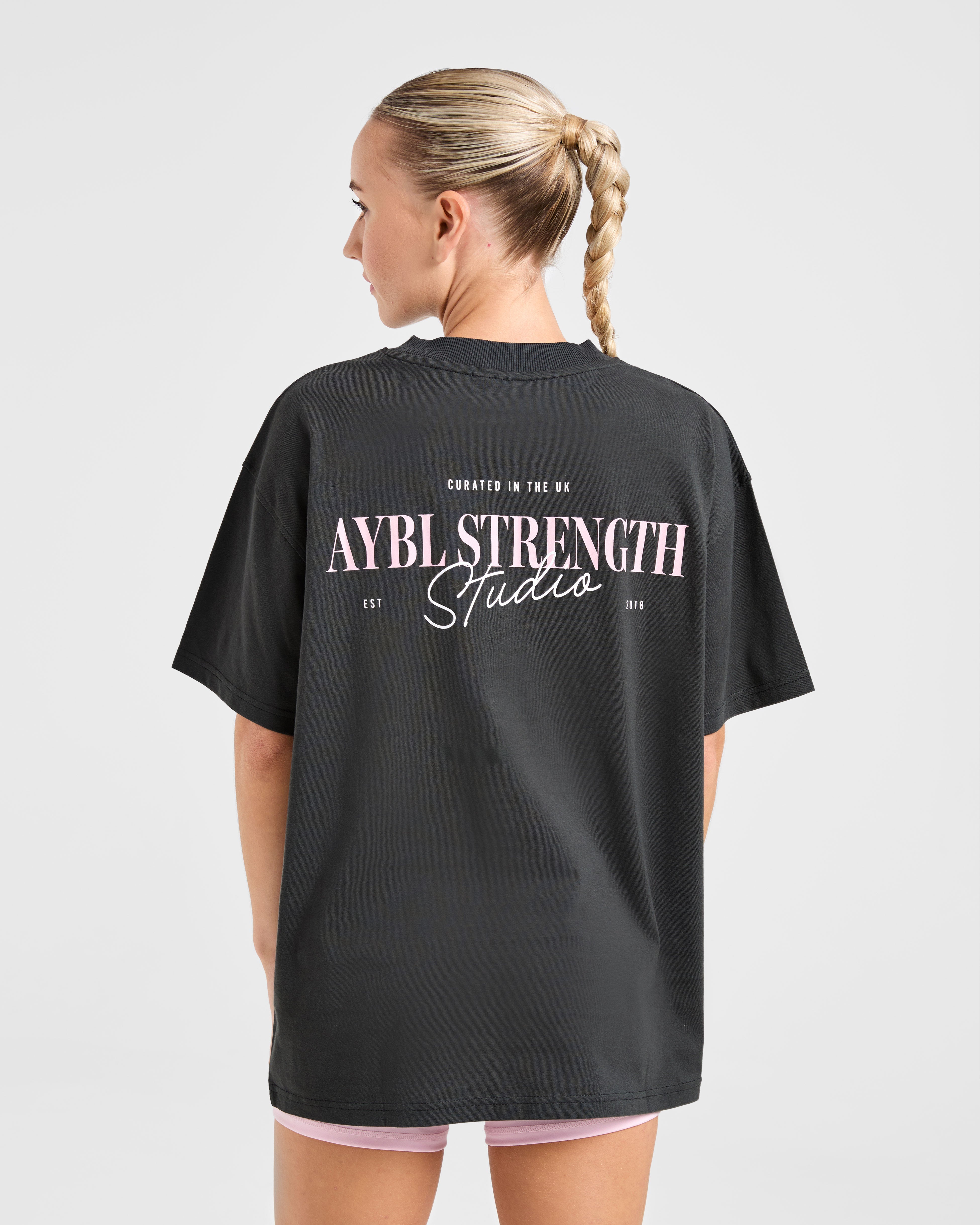 AYBL Strength Studio Oversized T Shirt – Charcoal/Pink AYBL Strength Studio Oversized T Shirt - Charcoal/Pink